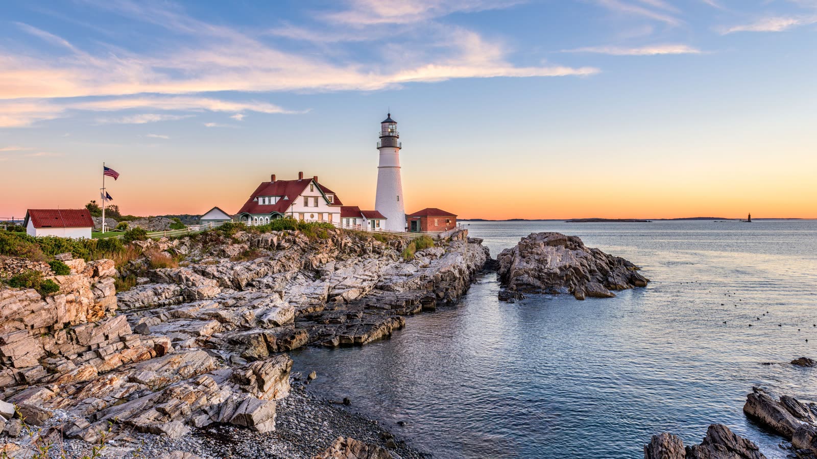 Classic Atlantic maritime coast at sunset &mdash; evocative of Cunard&rsquo;s heritage liner voyages; official fleet photography pending