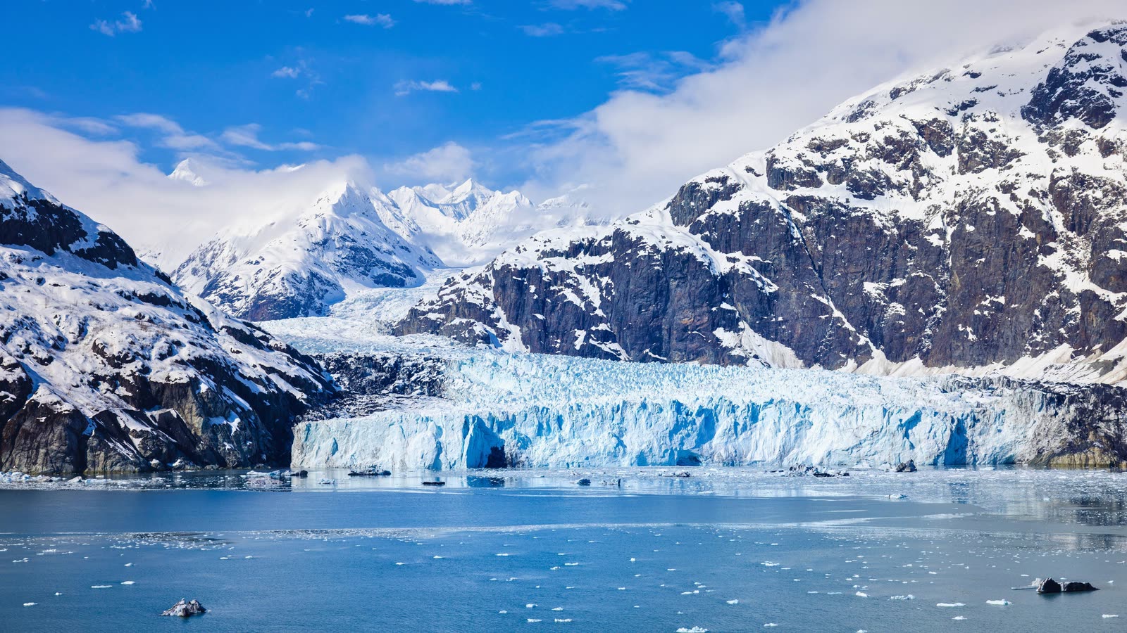Alaska's Glacier Bay with calving ice and snowcapped peaks